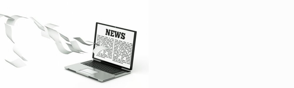 Ansicht eines Laptops, auf dem eine Newsseite angezeigt wird.
